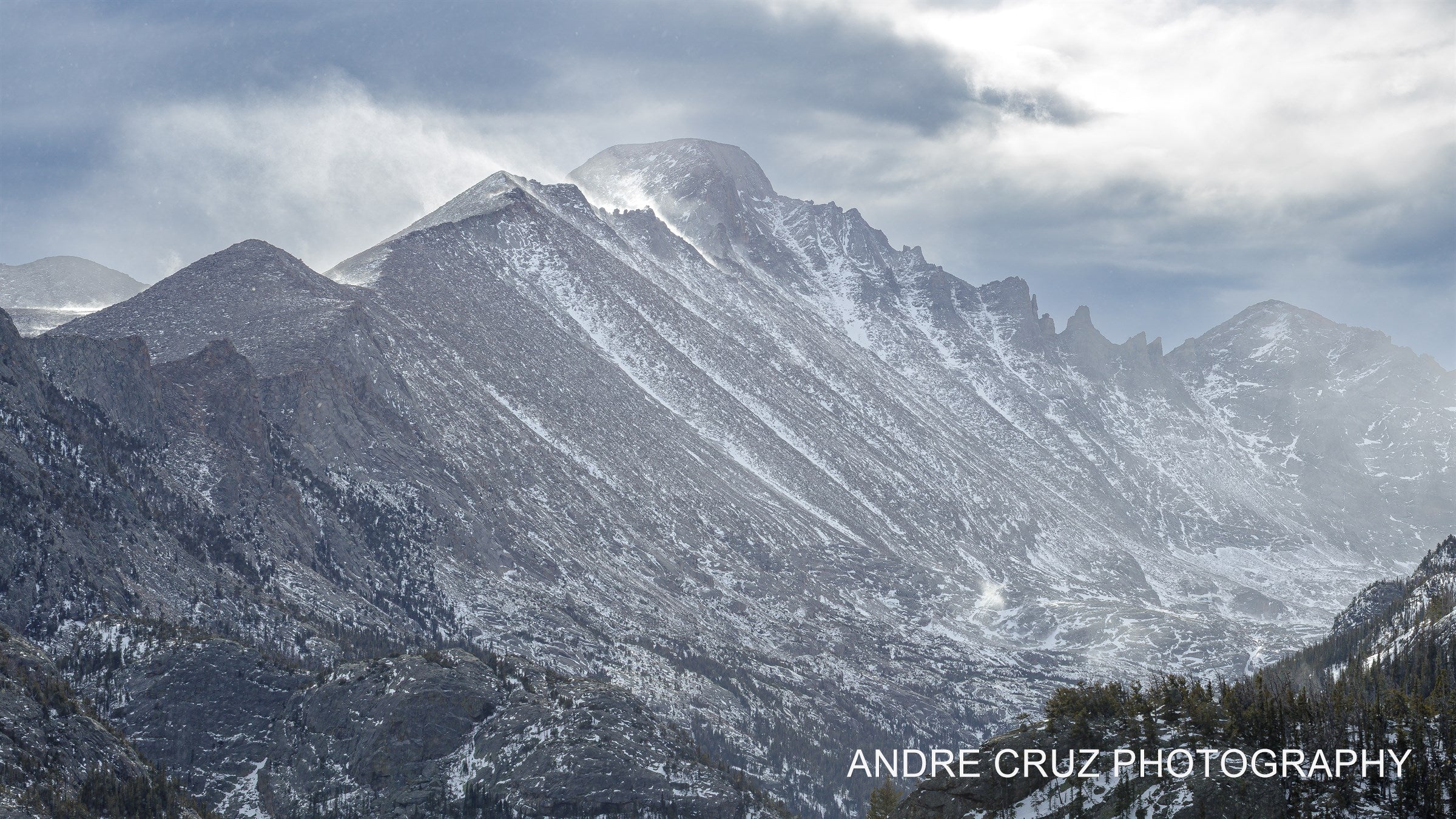 A long snow-covered ridge of the Continental Divide under heavy cloud, Rocky Mountain National Park