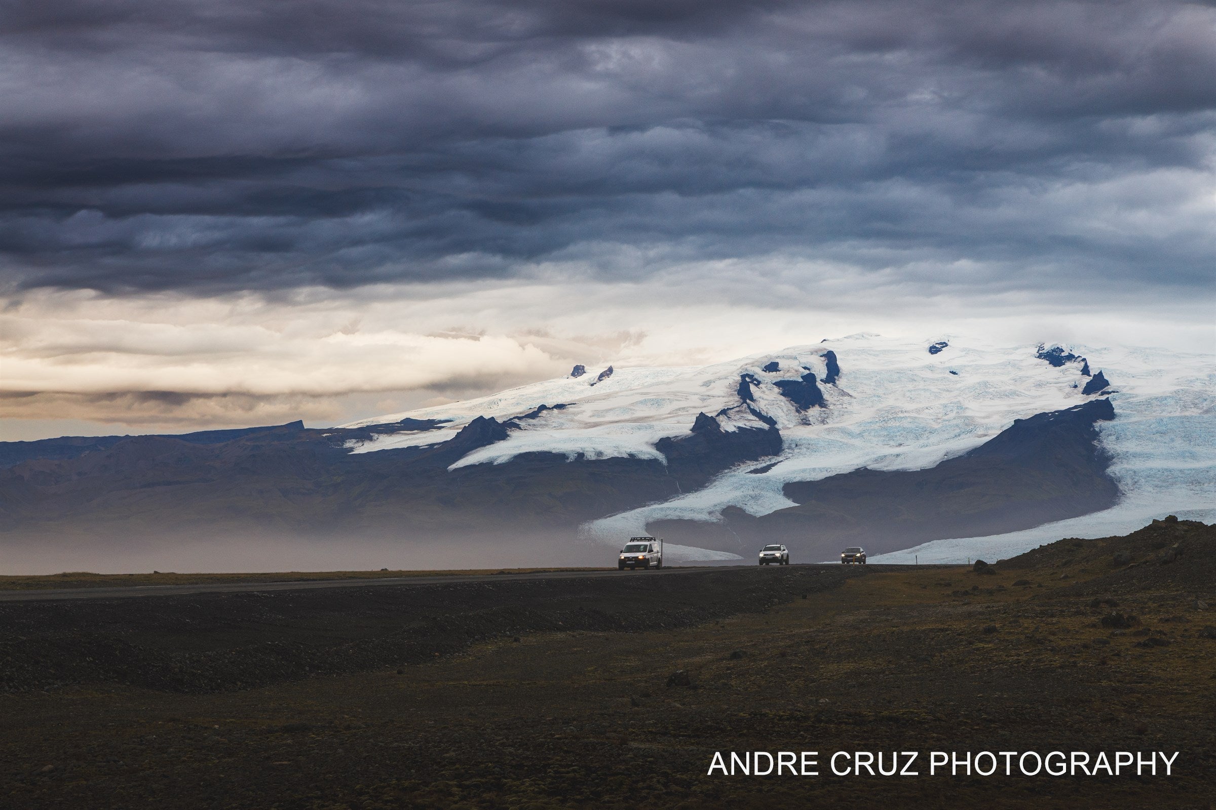 Field of broken ice on a glacial plain beneath distant mountains, Iceland