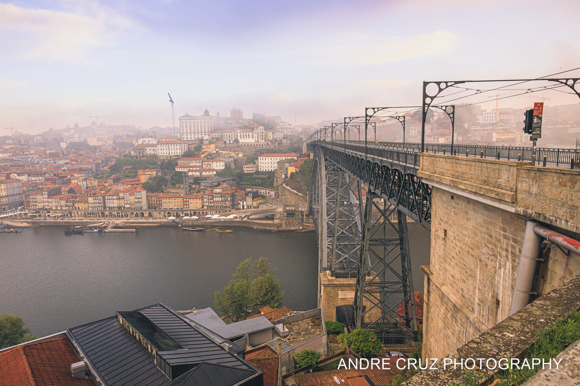 The Dom Luis I bridge over the Douro in morning mist, Porto